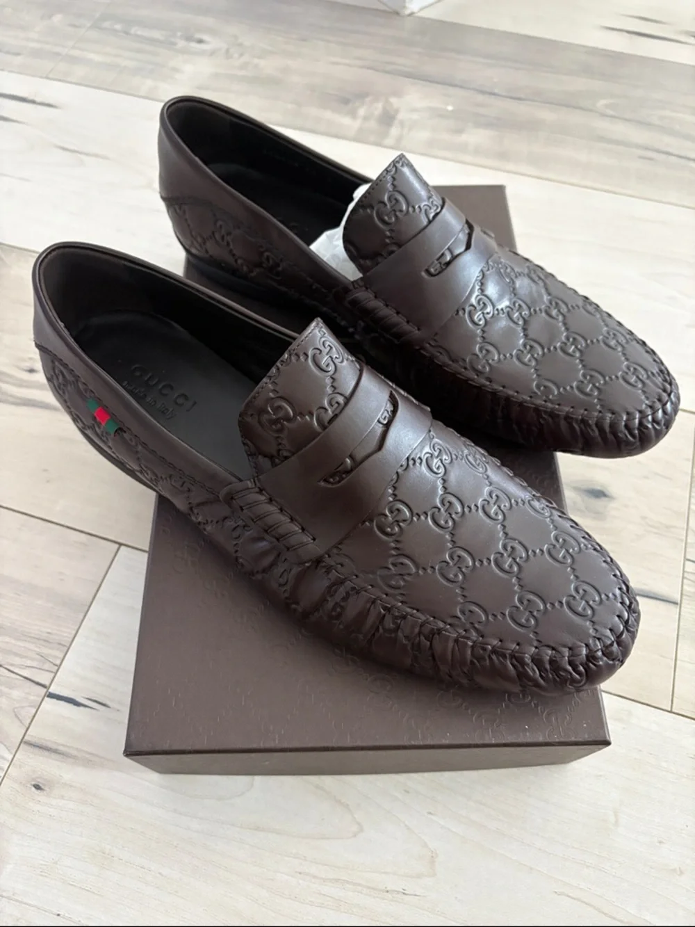 Gucci Men’s Brown Embossed Leather Penny Loafers